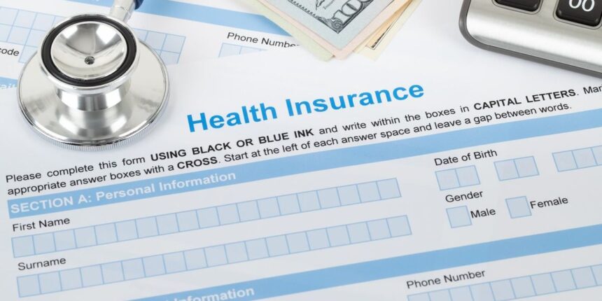 Health Insurance Application Form With Stethoscope And Calculator.jpg