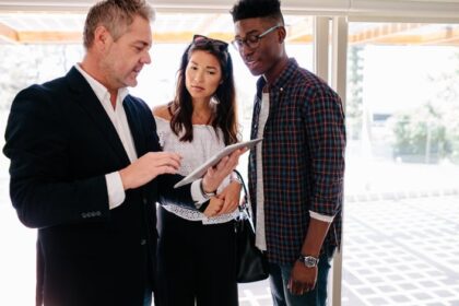 Couple With Realtor In House.jpg