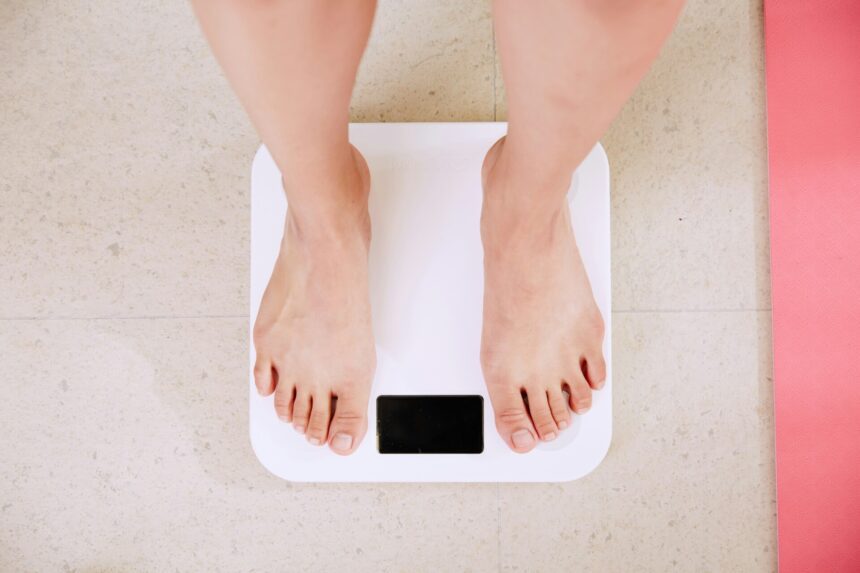 Person Standing On White Digital Bathroom Scale 8.jpg