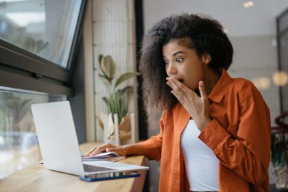 Surprised Young Woman Laptop.jpg